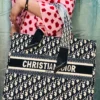 This image shows the CHRISTIAN D'IOR Large Size with zipper Tote Bag. sale on this website. #womensbag #imported #ladiesbag #bag #christiandior #LargeSizeBag #Universitybag.