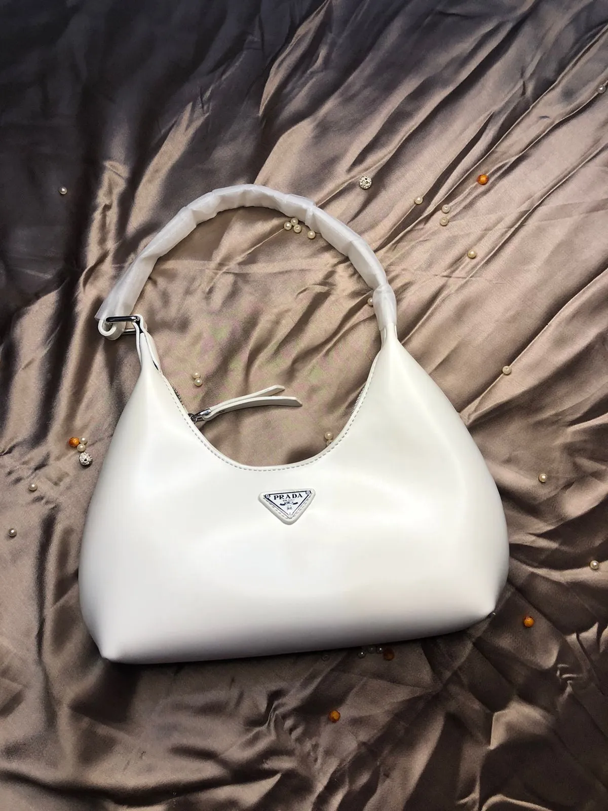 This image shows the Prada High Quality Shoulder Lady Armpit Adjustable Handle Bag sale on this website. #womensbag #imported #ladiesbag #bag.