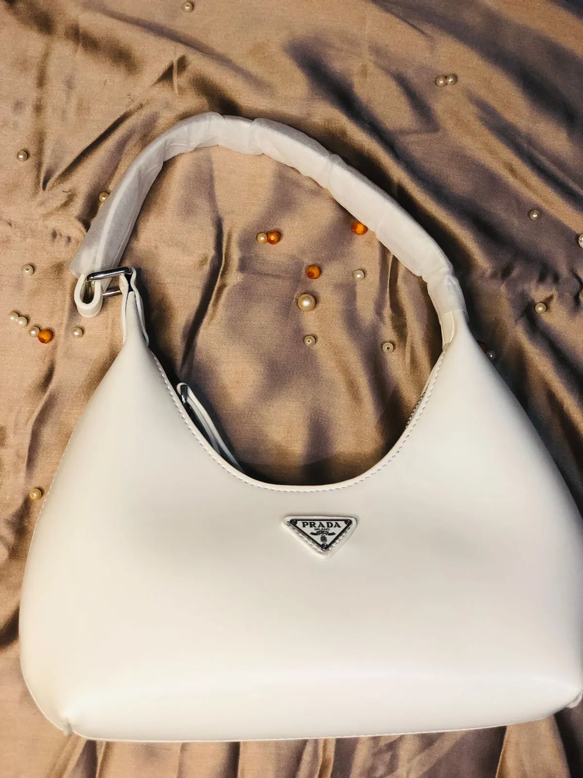 This image shows the Prada High Quality Shoulder Lady Armpit Adjustable Handle Bag sale on this website. #womensbag #imported #ladiesbag #bag.