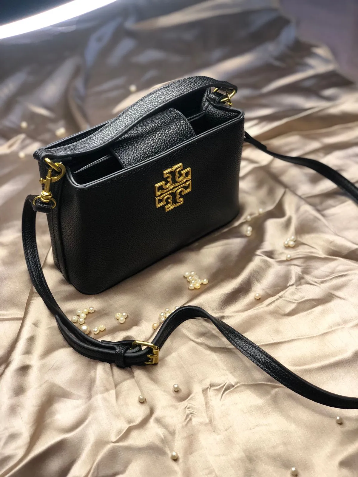 This image shows the Tory Burch Britten Micro Satchel (Black). sale on this website. #womensbag #imported #ladiesbag #bag #ToryBurchbag #mediumsizebag.6
