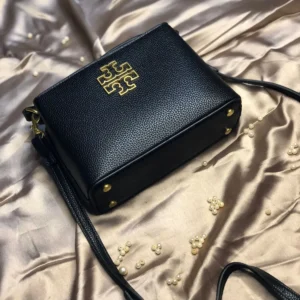 This image shows the Tory Burch Britten Micro Satchel (Black). sale on this website. #womensbag #imported #ladiesbag #bag #ToryBurchbag #mediumsizebag.