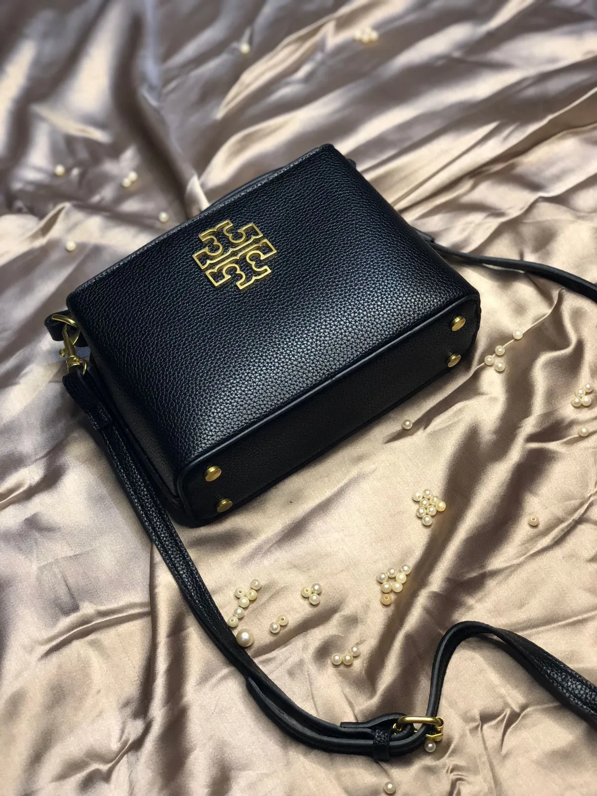 This image shows the Tory Burch Britten Micro Satchel (Black). sale on this website. #womensbag #imported #ladiesbag #bag #ToryBurchbag #mediumsizebag.